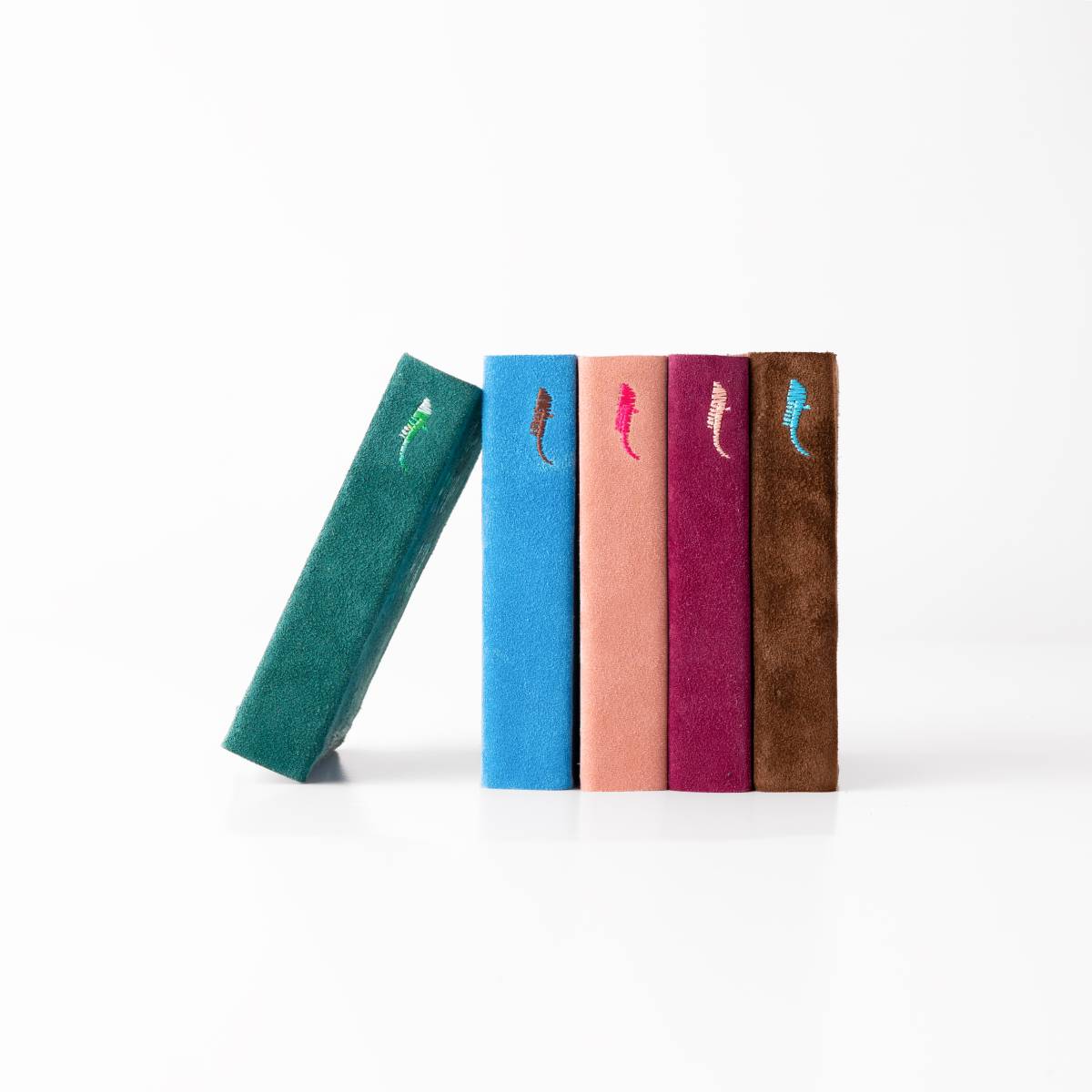 Acqua Alta Bookstore Diaries – Side View Acqua Alta Bookstore, Venice: Side view of the display of colorful notebooks
